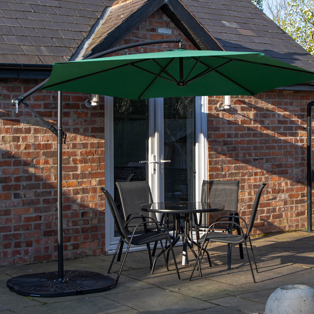 Samuel Alexander 4 Seater Glass Top Stackable Dining Set with Green Banana Parasol and Base Image 1