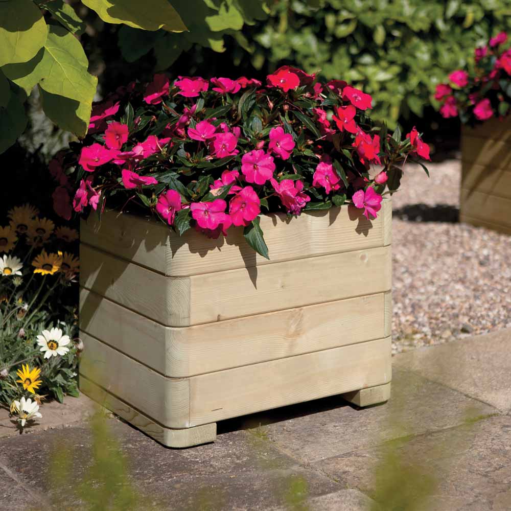 Rowlinson Marberry Square Planter  - wilko  - Garden & Outdoor The Rowlinson Marberry Square Planter is an attractive and contemporary garden planter designed to add colour and dynamism to your garden displays. With sleek rounded corners, and delivered pre-assembled with fitted liner, the Square Planter is part of the premium Rowlinson Marberry Range. This natural timber finish square planter is pressure treated against rot. Finished to the highest quality standards it gives you the confidence to start creating stunning floral displays right away. Approximate capacity: 62 Litres.