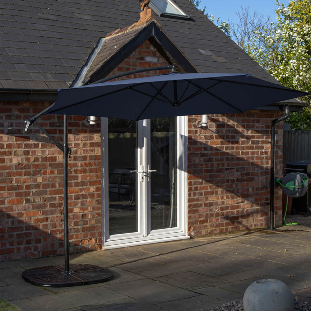 Samuel Alexander 6 Seater Glass Top Outdoor Dining Set with Blue Banana Parasol and Base Image 3