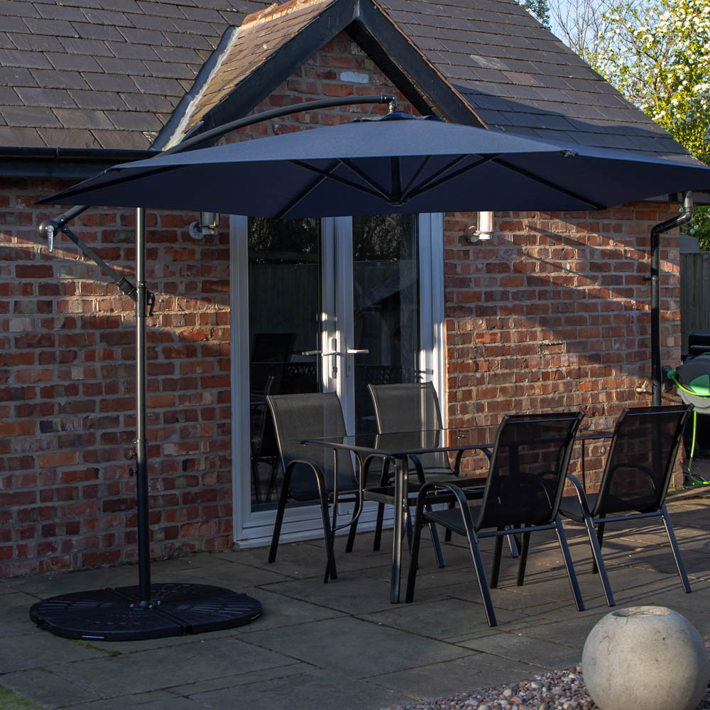 Samuel Alexander 4 Seater Glass Top Outdoor Dining Set with Blue Banana Parasol and Base Image 2