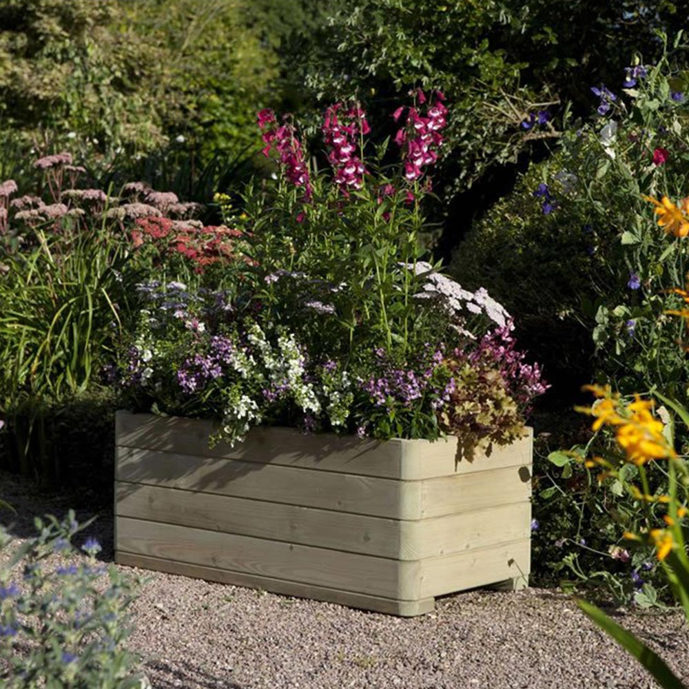 Rowlinson Marberry Rectangular Planter  - wilko  - Garden & Outdoor The Rowlinson Marberry Rectangular Planter is an attractive and contemporary garden designed to add colour and dynamism to your garden displays. With sleek rounded corners, and delivered pre-assembled with fitted liner, the Rectangular Planter is part of the premium Rowlinson Marberry Range. This natural timber finish rectangular planter is pressure treated against rot. Finished to the highest quality standards it gives you the confidence to start creating stunning floral displays right away. Approximate capacity: 135 Litres.