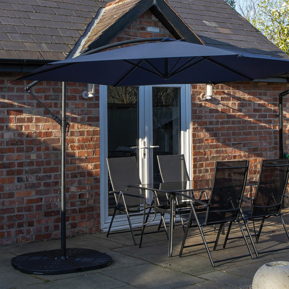 Samuel Alexander 4 Seater Glass Top Outdoor Dining Set with Blue Banana Parasol and Base Image 1