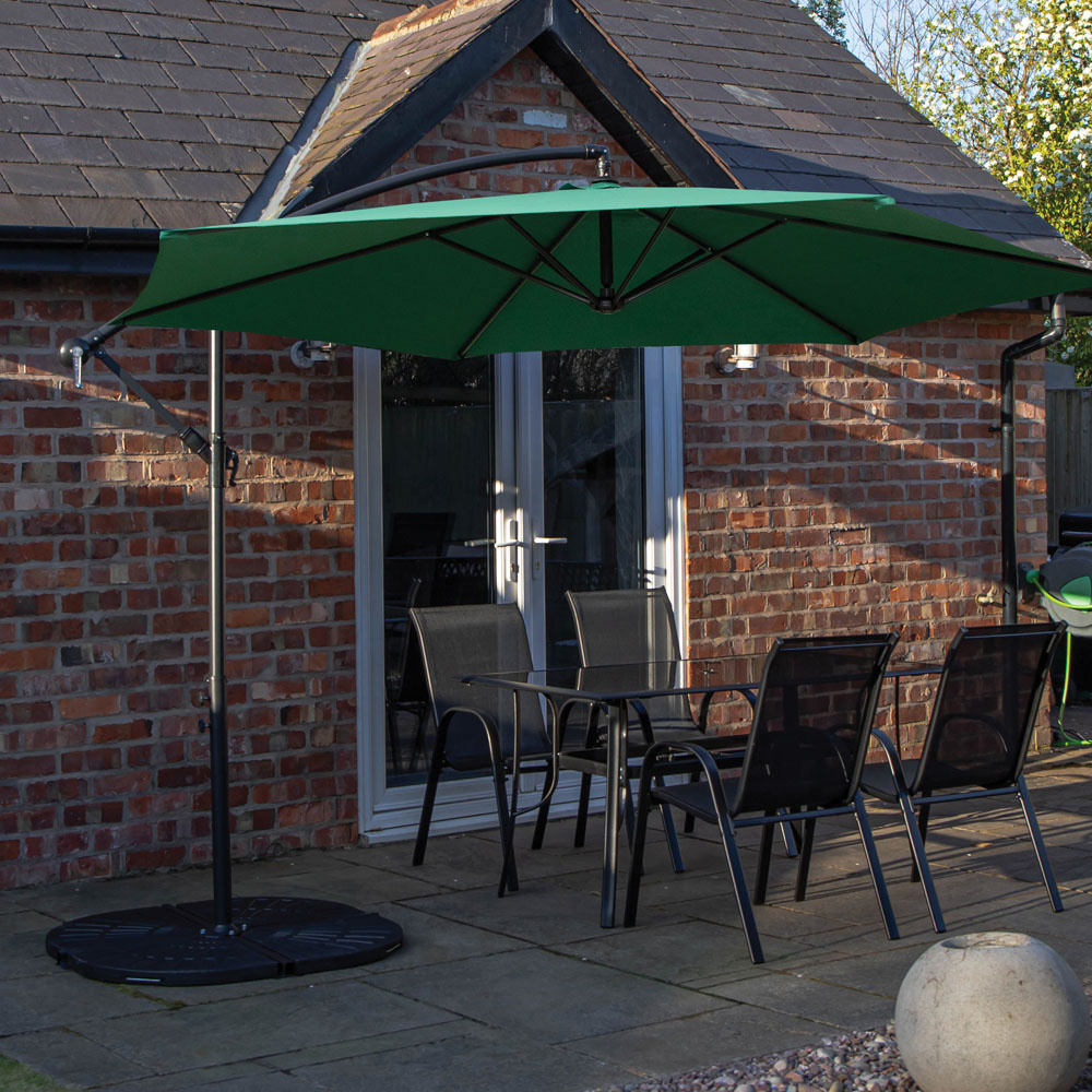 Samuel Alexander 4 Seater Glass Top Outdoor Dining Set with Green Banana Parasol and Base Image 1