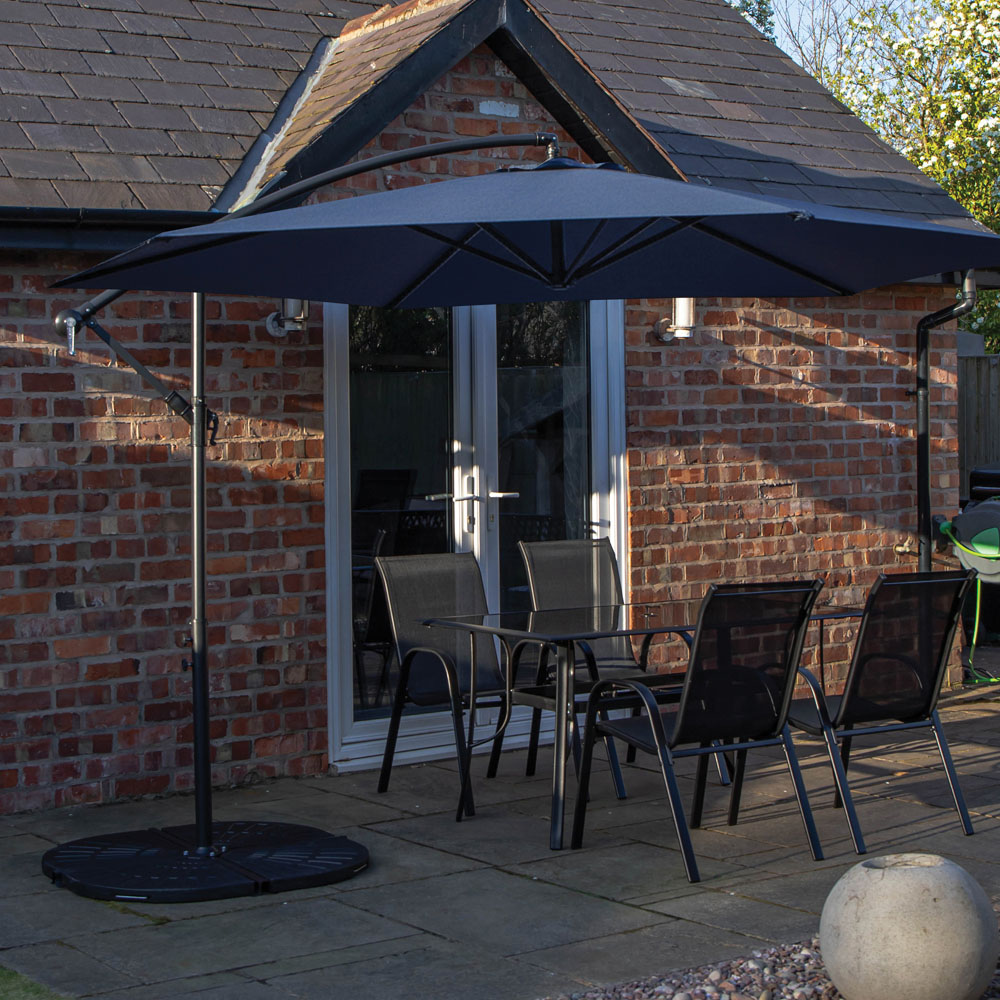 Samuel Alexander 4 Seater Glass Top Outdoor Dining Set with Blue Banana Parasol and Base Image 1