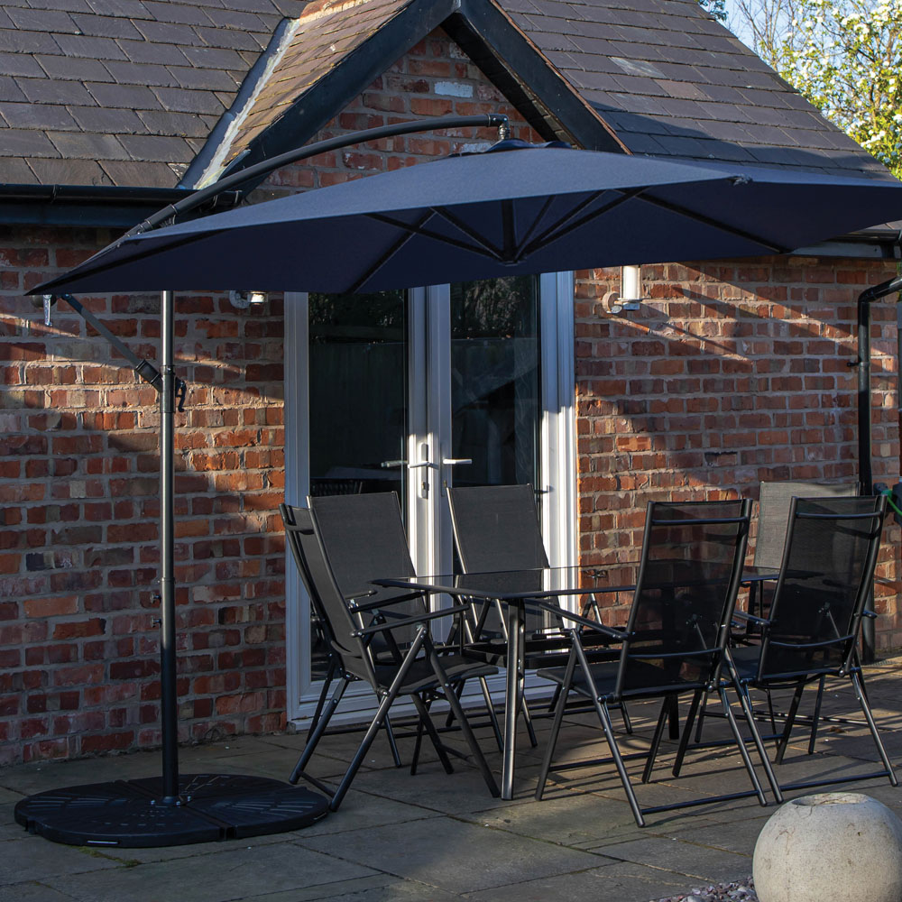 Samuel Alexander 6 Seater Glass Top Outdoor Dining Set with Blue Banana Parasol and Base Image 1
