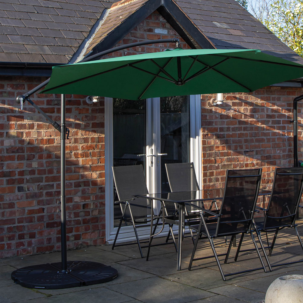 Samuel Alexander 4 Seater Glass Top Outdoor Dining Set with Green Banana Parasol and Base Image 1