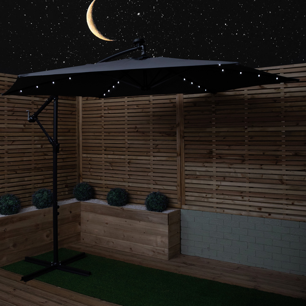 Samuel Alexander 6 Seater Glass Top Outdoor Dining Set with Grey Banana Lit Parasol and Base Image 3