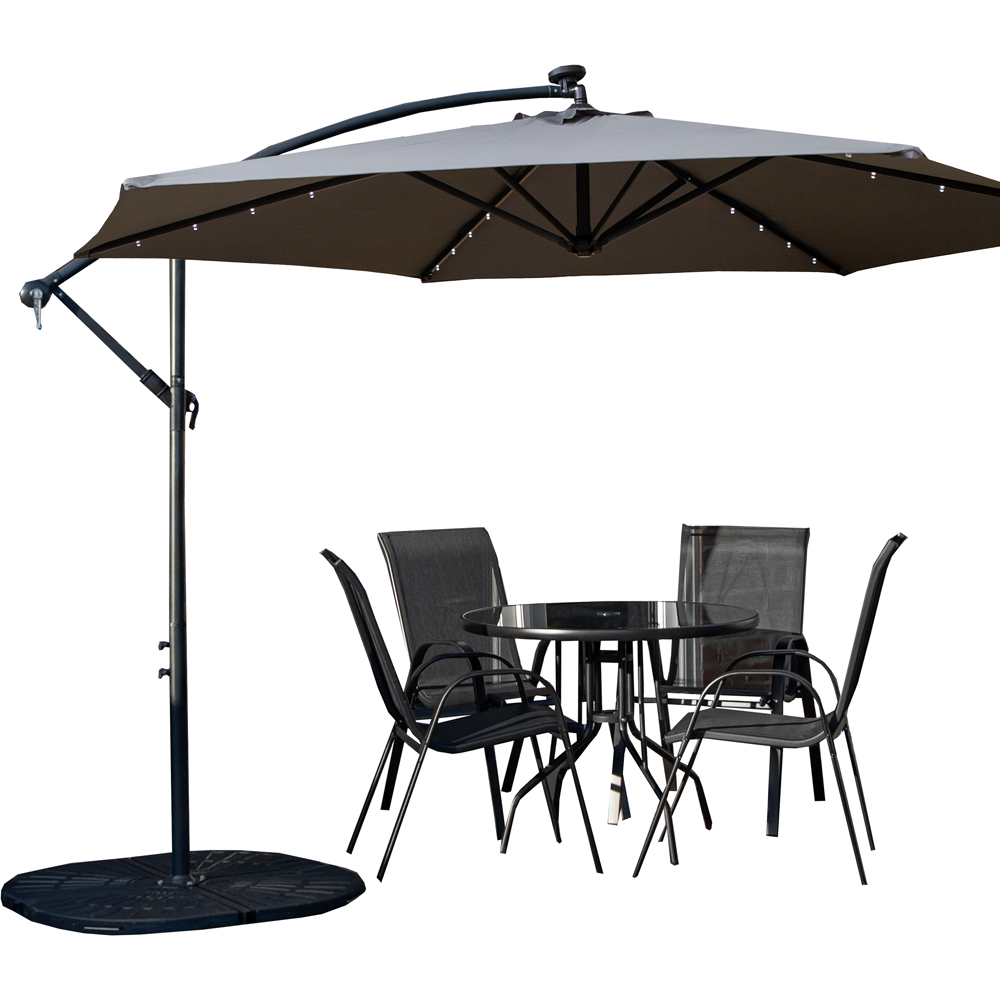 Samuel Alexander 4 Seater Glass Top Stackable Dining Set with Grey Banana Lit Parasol and Base Image 2