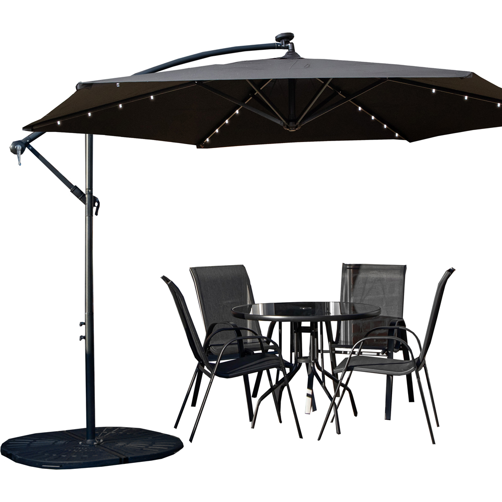 Samuel Alexander 4 Seater Glass Top Stackable Dining Set with Black Banana Lit Parasol and Base Image 2