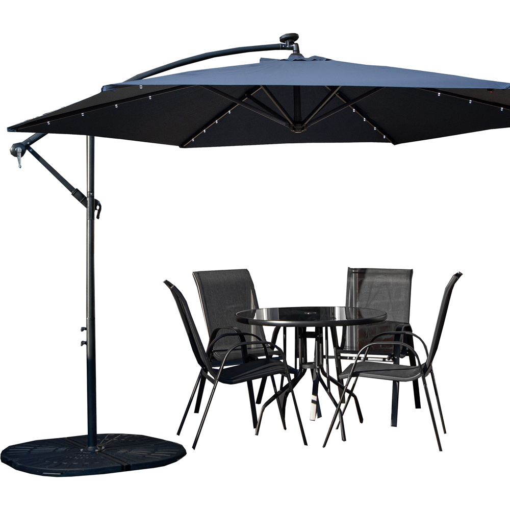 Samuel Alexander 4 Seater Glass Top Stackable Dining Set with Blue Banana Lit Parasol and Base Image 2