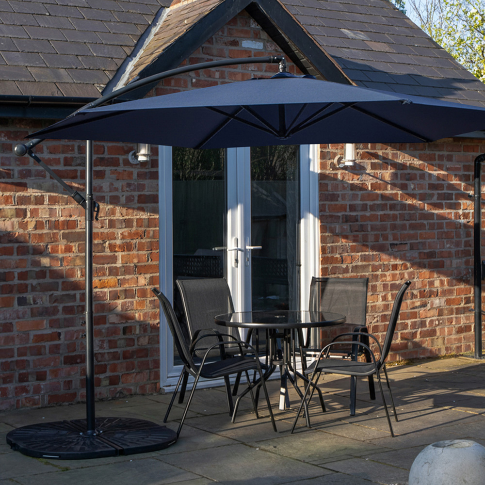 Samuel Alexander 4 Seater Glass Top Stackable Dining Set with Blue Banana Parasol and Base Image 1