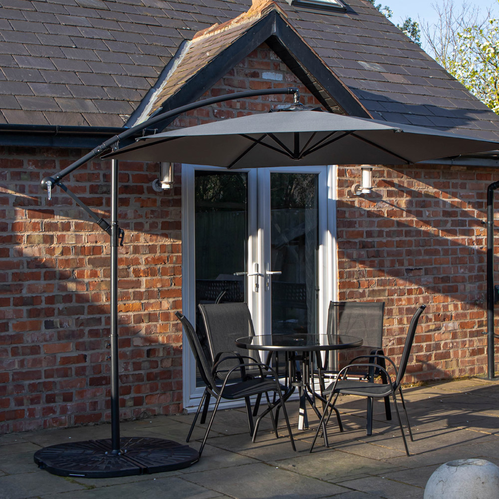 Samuel Alexander 4 Person Round Glass Top Garden Dining Set with Grey Banana Parasol Image 1