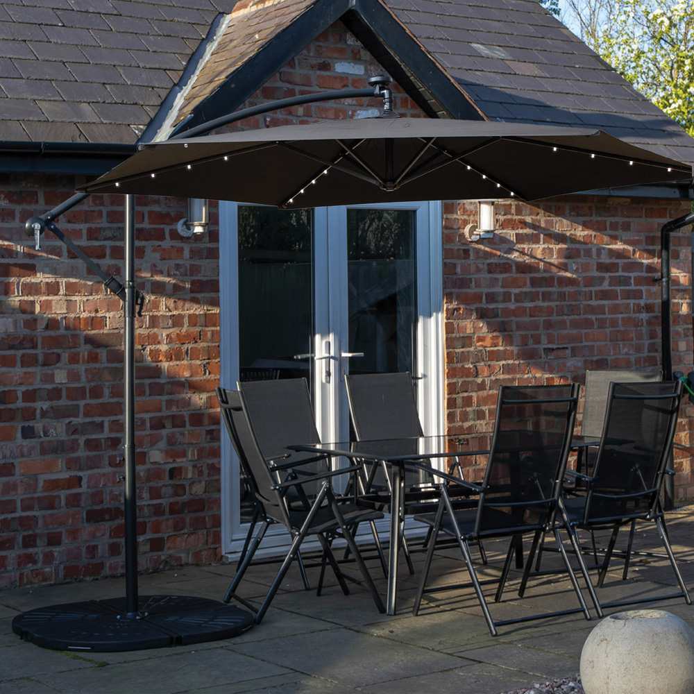 Samuel Alexander 6 Seater Glass Top Outdoor Dining Set with Grey Banana Lit Parasol and Base Image 1
